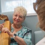 Harpist’s 25-Year Mission Brings Healing Music to Hospital Bedsides