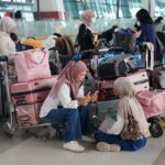 Flights to and from Indonesia’s capital resume after volcanic eruption forced a 2-day closure