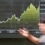 Oil prices edge lower, while Asian shares rise, tracking Wall Street gains