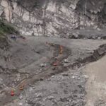 China exerts tight grip on information after floods