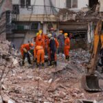 Rescuers search for people trapped in a New Delhi building collapse as death toll rises to 6